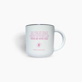 White mug with pink religious text and a black rim