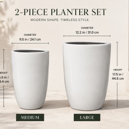 Two white ceramic planter pots in medium and large sizes