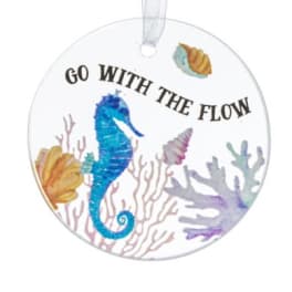 Round hanging ornament with a seahorse and the words Go With The Flow