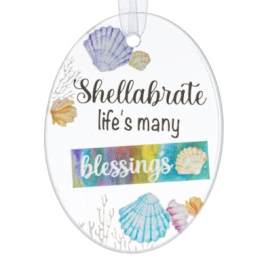 Oval shell ornament with the words "Shellabrate life's many blessings"
