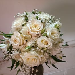 Bouquet of white roses and small white filler flowers
