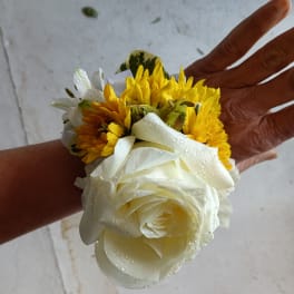 Small white rose and yellow daisy wrist corsage with ribbon