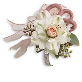 Small white and blush floral corsage with ribbon and pearl accents