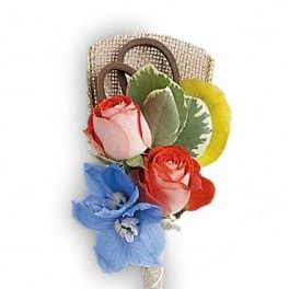 Boutonniere with red, pink, blue, and yellow flowers