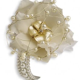 White floral corsage with pearl accents and gold wire