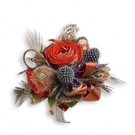 Small floral arrangement with red roses and dried accents