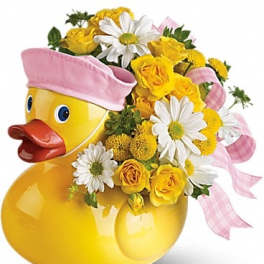 Yellow duck-shaped container with yellow and white flowers and pink ribbon