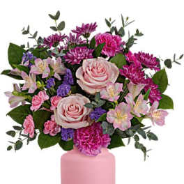 Pink and purple mixed bouquet in a pink vase