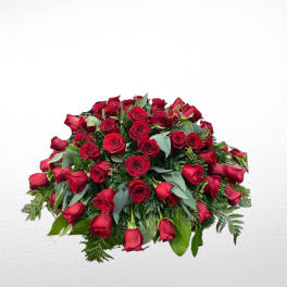 Large bouquet of red roses with mixed greenery