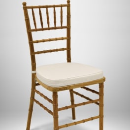 Wooden chair with a white seat cushion