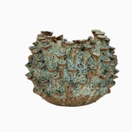 Textured ceramic vase with a blue-green and brown speckled surface