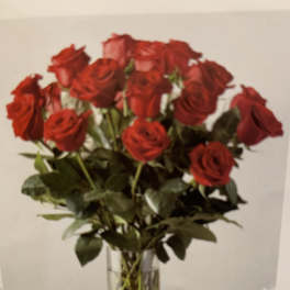 Bouquet of red roses in a clear glass vase