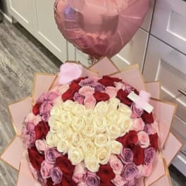 Heart-shaped rose bouquet with pink balloons