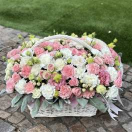 Pink and white flower basket with a white handle