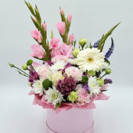 Pink and white mixed bouquet in a round pink box
