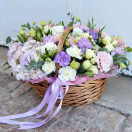 Pastel flower basket with roses, carnations, and hydrangeas