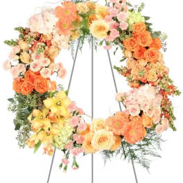 Large pastel floral wreath on a metal stand