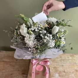 White mixed bouquet in a gift box with a pink ribbon