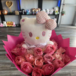 Pink rose bouquet with a Hello Kitty plush topper