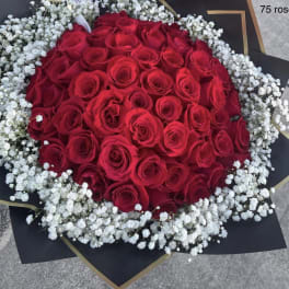 Large bouquet of red roses surrounded by white baby's breath