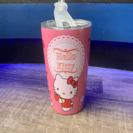 Pink Hello Kitty tumbler with a clear lid and straw