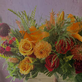 Bright mixed bouquet with orange, yellow, and red flowers