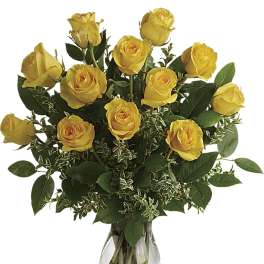Yellow roses arranged in a clear glass vase
