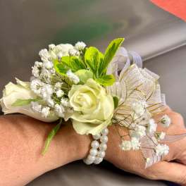 White rose wrist corsage with baby's breath and pearl bracelet