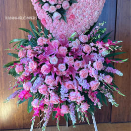 Large pink floral heart and standing spray with roses and lilies