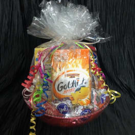 Gift basket with snack packages wrapped in clear cellophane and curled ribbons