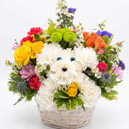 Colorful flower basket with a white plush dog face in the center