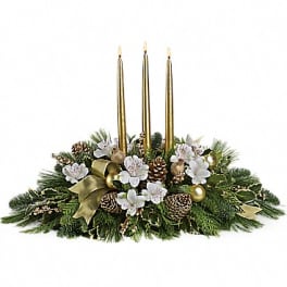 Holiday centerpiece with three gold candles and white flowers