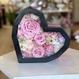 Beautiful preserved flowers and necklace in heart box