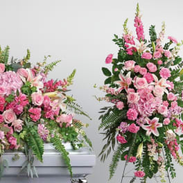 Always remembered pink casket and standing spray