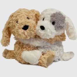 Two plush dog toys sitting together on a white background