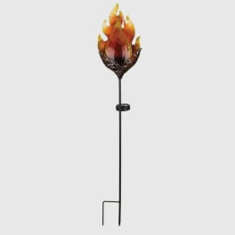 Decorative flame-shaped glass topper on a tall black metal stake