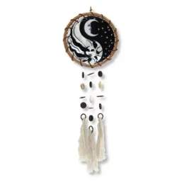 Round wall hanging with a black-and-white moon design and cream tassels
