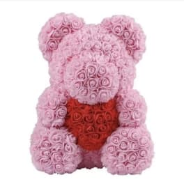 Pink rose teddy bear holding a red heart
