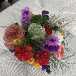 Mixed bouquet with pink, red, purple, and yellow flowers