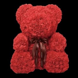 Red rose teddy bear with a ribbon bow