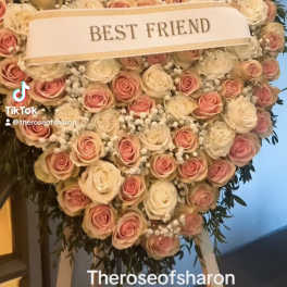 Heart-shaped rose arrangement with a "BEST FRIEND" ribbon