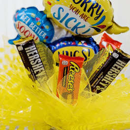 Candy bouquet with balloons and chocolate bars in a jar