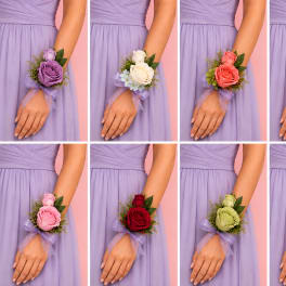 Bridal wrist corsages with roses and ribbon on a lavender dress