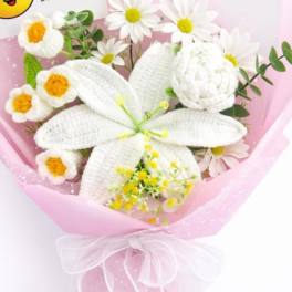 Pink-wrapped bouquet with white daisies and a large white lily