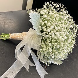 White baby's breath bouquet with a sheer ribbon wrap