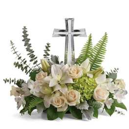 Low white and cream flower arrangement with crystal cross centerpiece and green accents