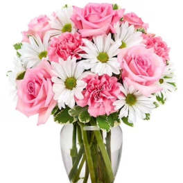 Pink roses and white daisies arranged in a clear glass vase