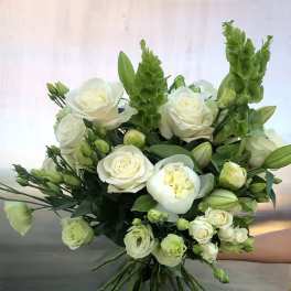 Bouquet of white roses and green blooms with long stems
