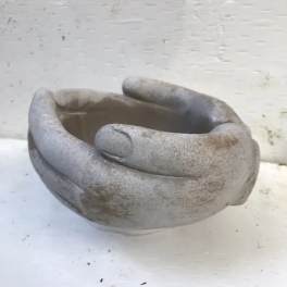 Gray sculptural ceramic bowl with a hand-shaped rim