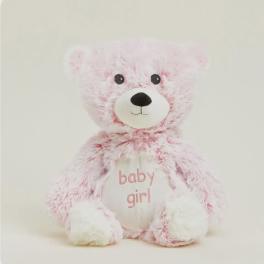 Pink teddy bear with "baby girl" text on its belly